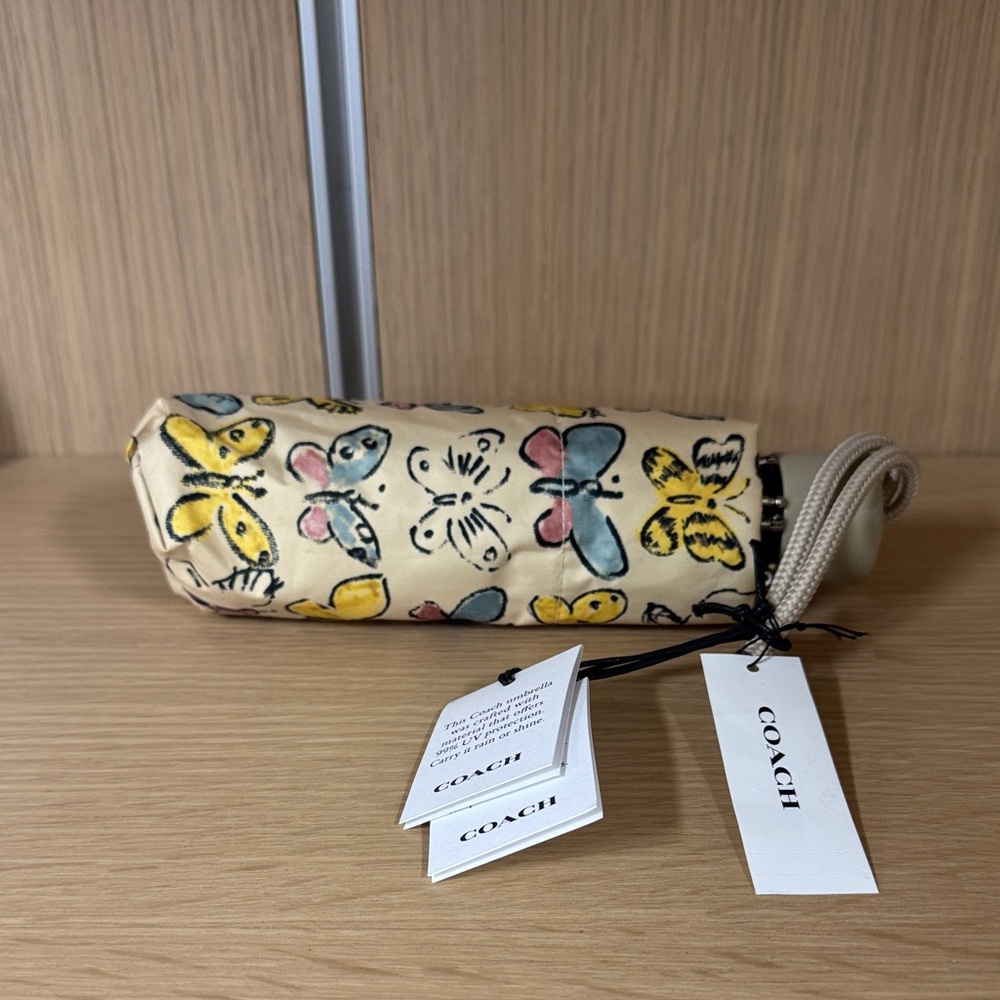 Coach Floral Butterfly Print Compact Umbrella in Cream, Yellow, Blue, Pink